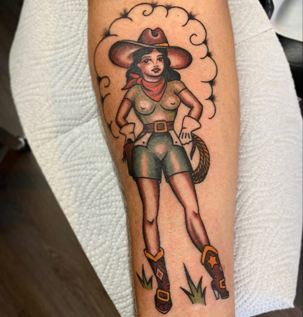 Cowgirl tattoo for women in leg